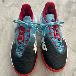 Women’s size 10 Adidas Barricade tennis shoes.